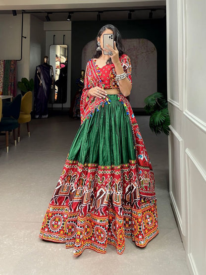 Vibrant Elegance: Red and Green Dola Silk Lehenga with Gamthi and Mirror Work